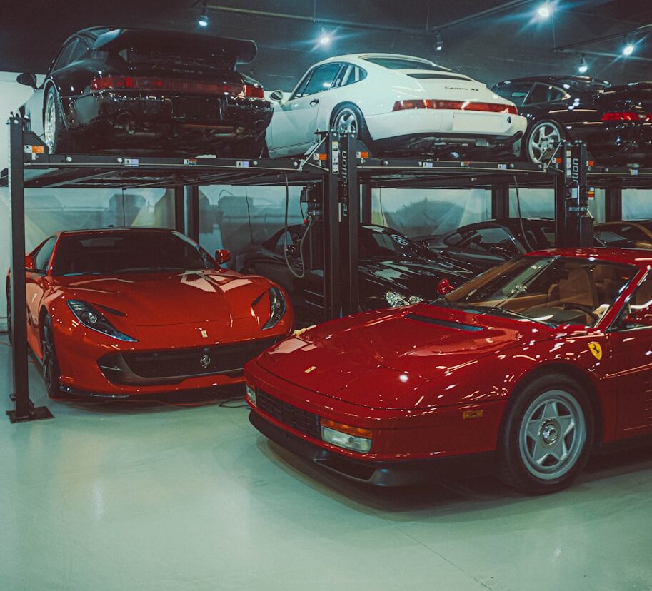 a garage filled with lots of different types of cars
